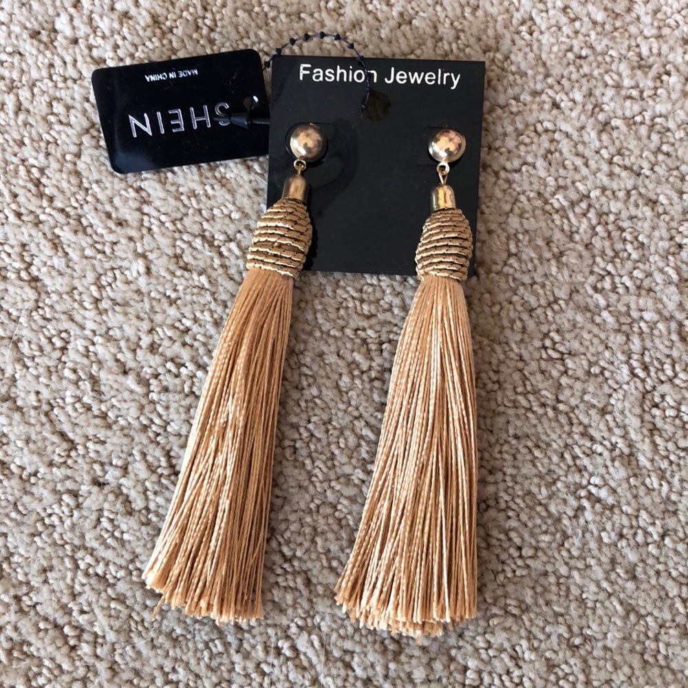 Gold tassel earrings.